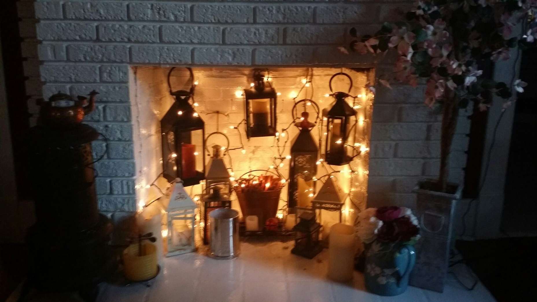 Decorate Your Unused Fireplace with Lanterns and Lights