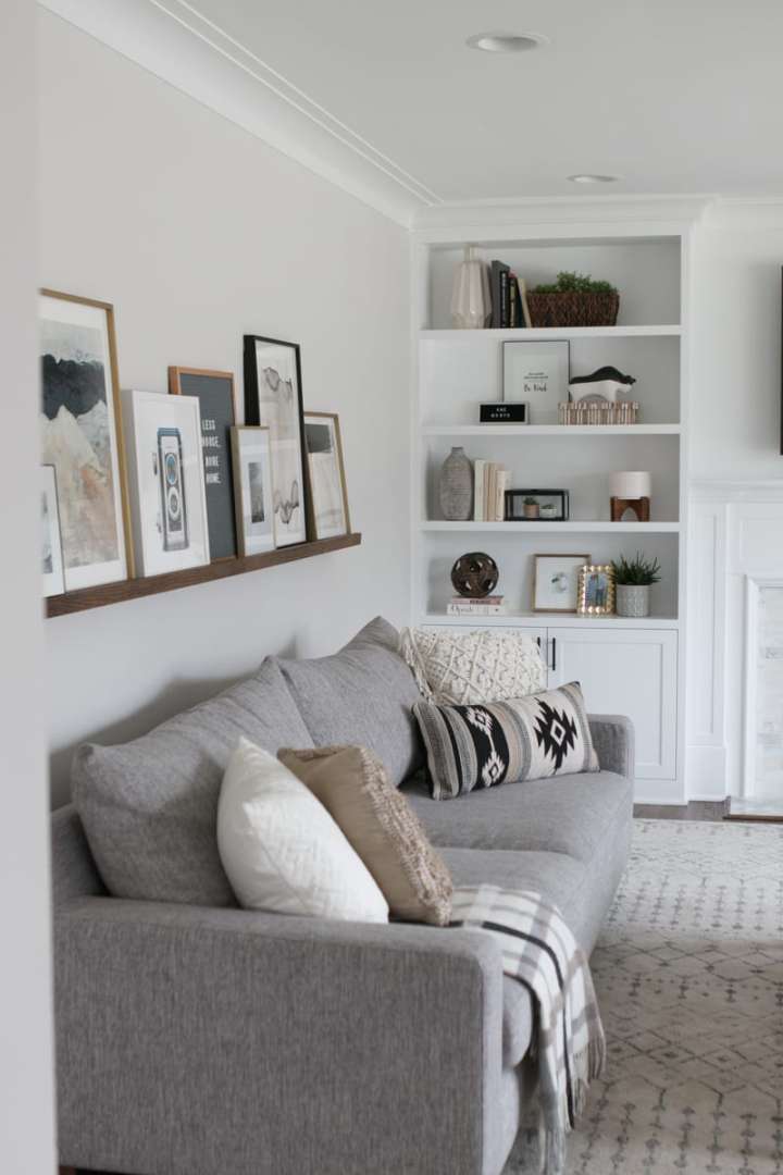 DIY Picture Ledge Over the Couch Filled with Art  The DIY Playbook
