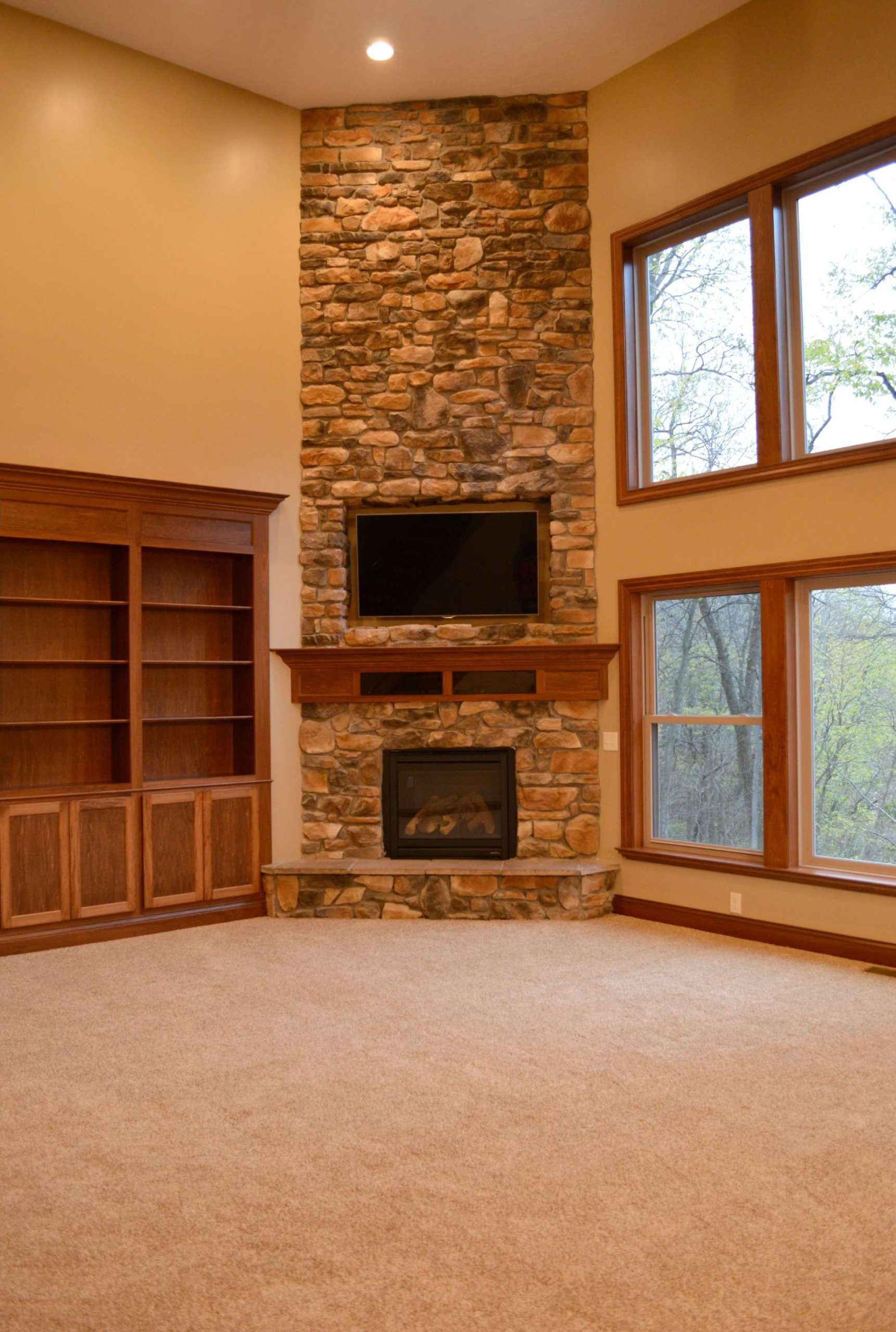 Floor to ceiling corner stone fireplace  Stone fireplace designs
