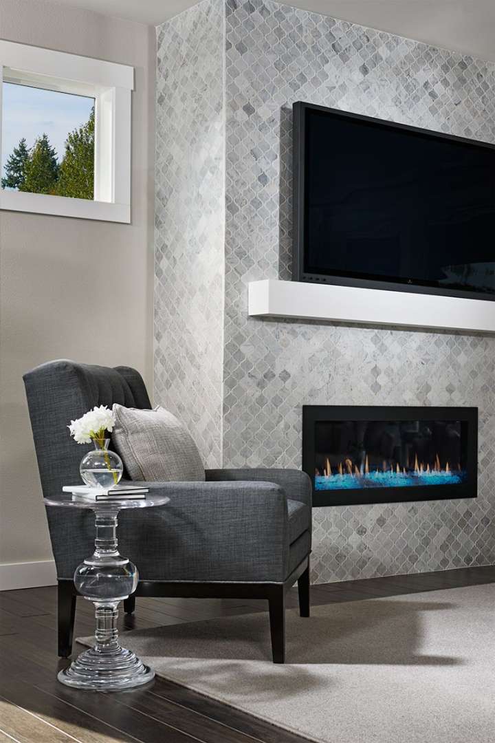 Floor-to-ceiling tile fireplace surround in our Lincoln model home