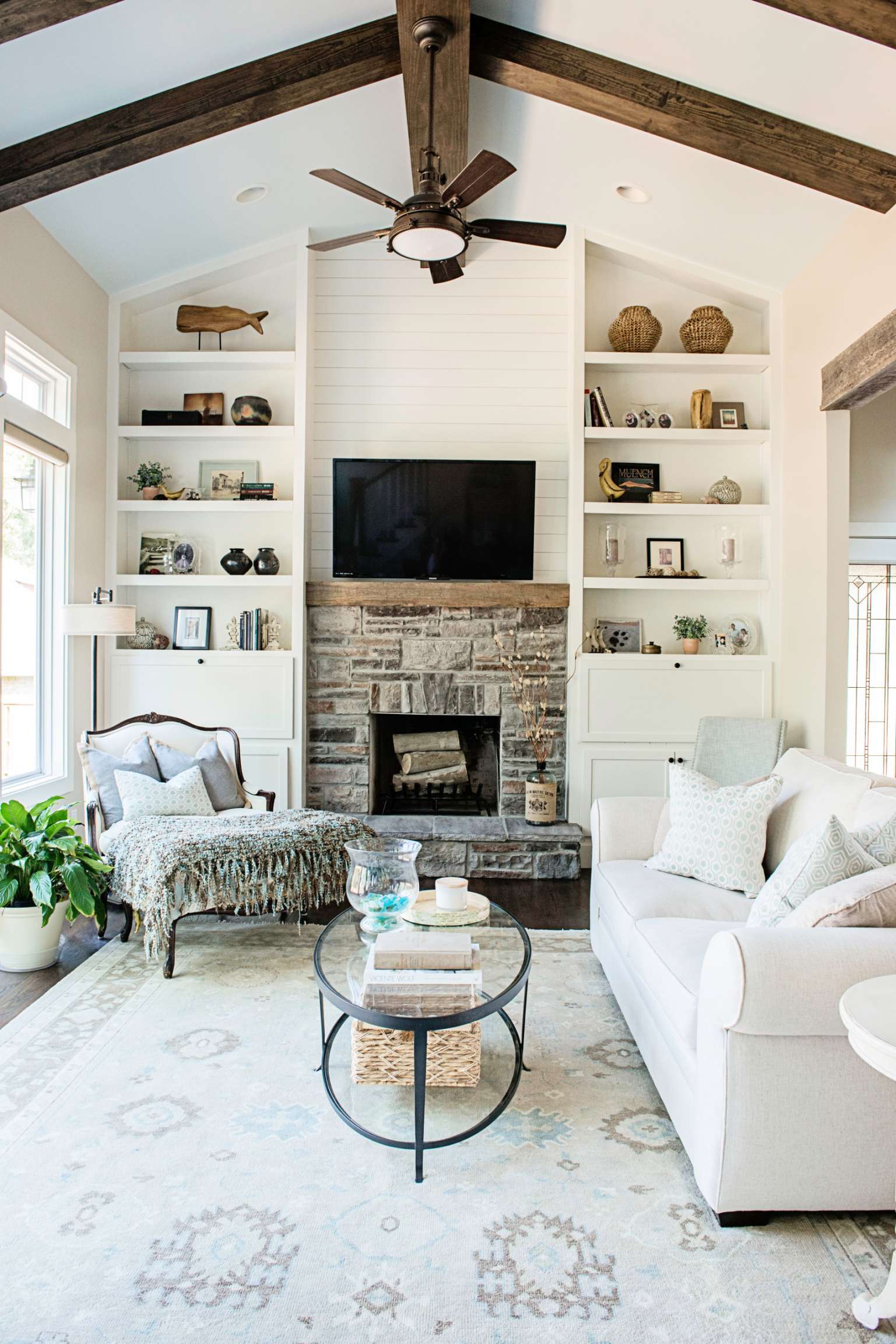 Shiplap Wall Living Room with a Stacked Stone Fireplace Ideas