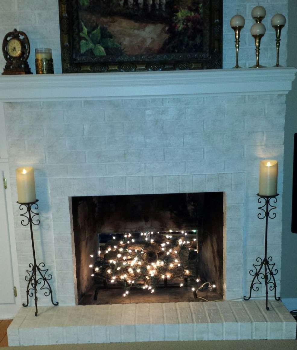 Twinkle lights in fireplace  Fireplace lighting, Fake fireplace