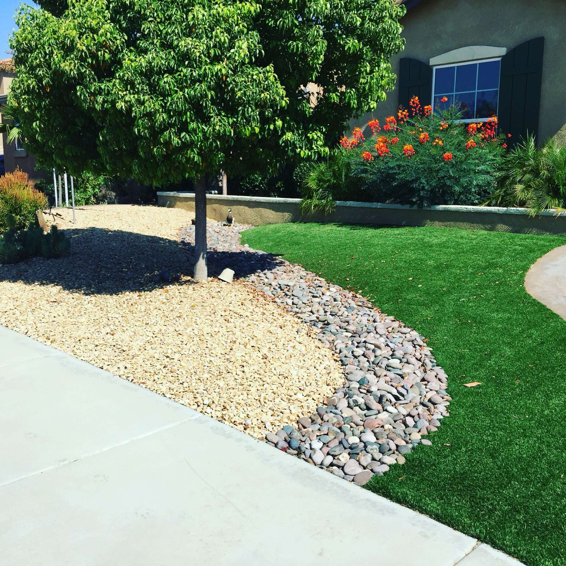 Artificial Turf and Rock Design for Front Yard Landscaping