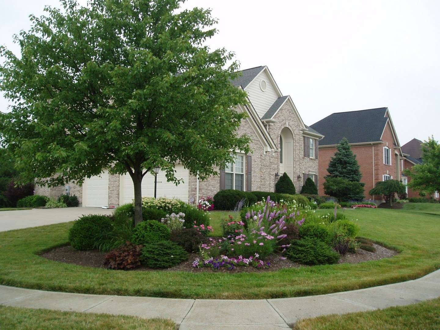 Brick Exterior Large Corner Lot with beautiful landscaping Back of