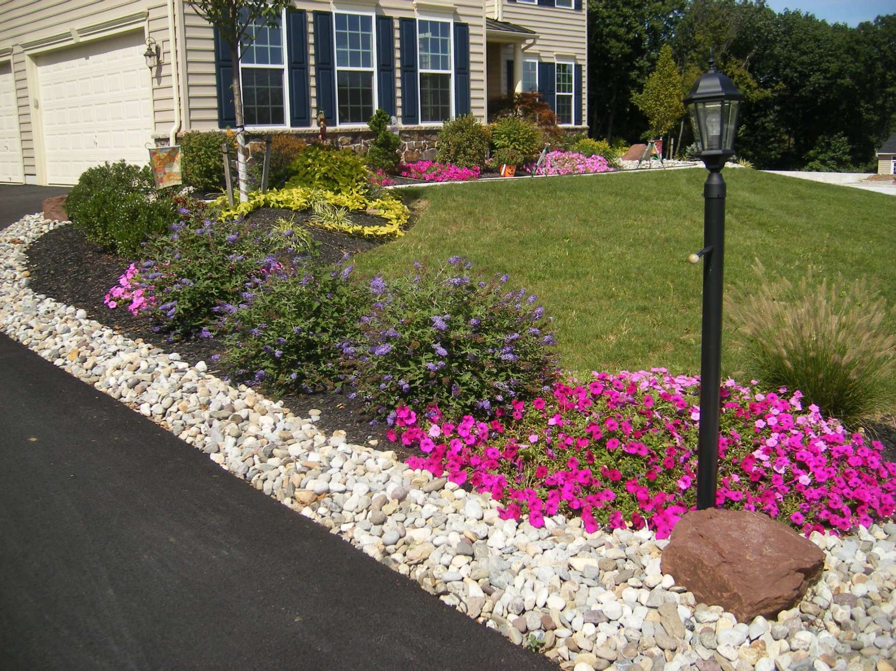 Lining the driveway  Small front yard landscaping, Stone