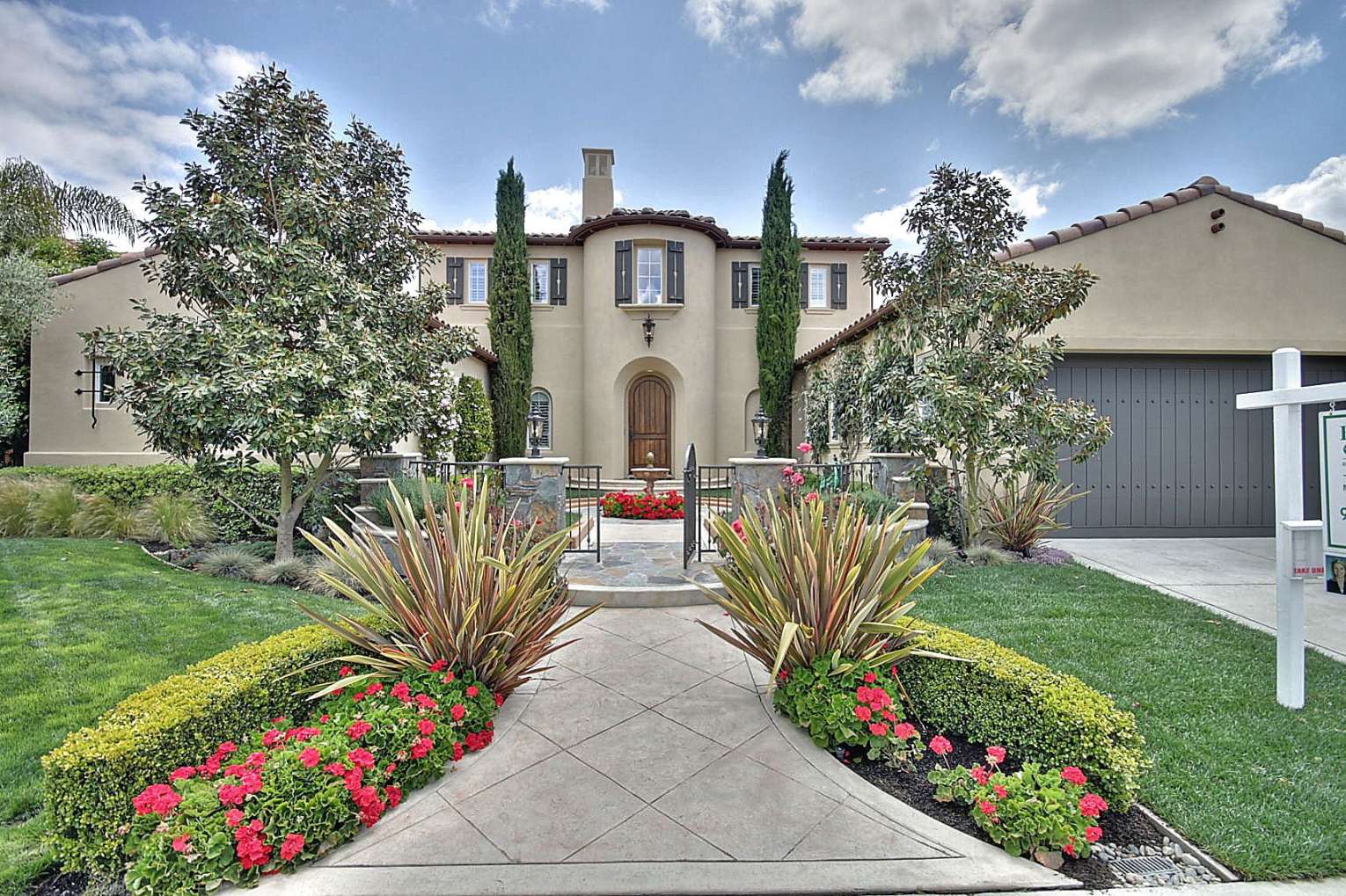 Luxurious home, high end landscape, Italian cypress trees
